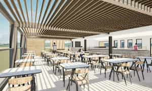 Bildet föreställer en modern inomhusrestaurang med stora fönster, bord och stolar samt personer som rör sig i olika delar av lokalen. (AI-genererad text)