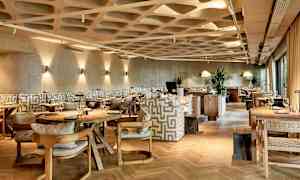 Bild på en modern restaurang med stilfull inredning. (AI-genererad text)