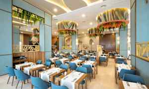 En modern restauranginteriör med träbord, blå stolar och gröna dekorationer. (AI-genererad text)