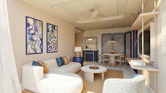 Ett modernt vardagsrum med beige soffa, färgglada väggmålningar och bord. (AI-genererad text)