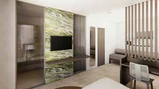 Modern hotellrum med tv och marmordekor på väggen. (AI-genererad text)