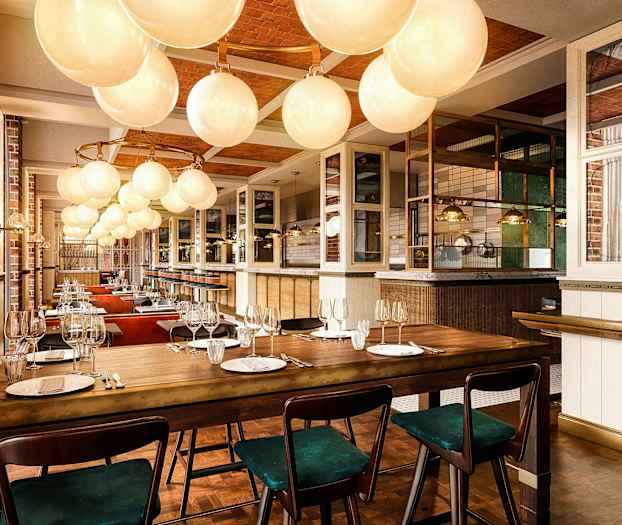 Interiör av en elegant restaurang med dukade matbord och glasslampor i taket. (AI-genererad text)
