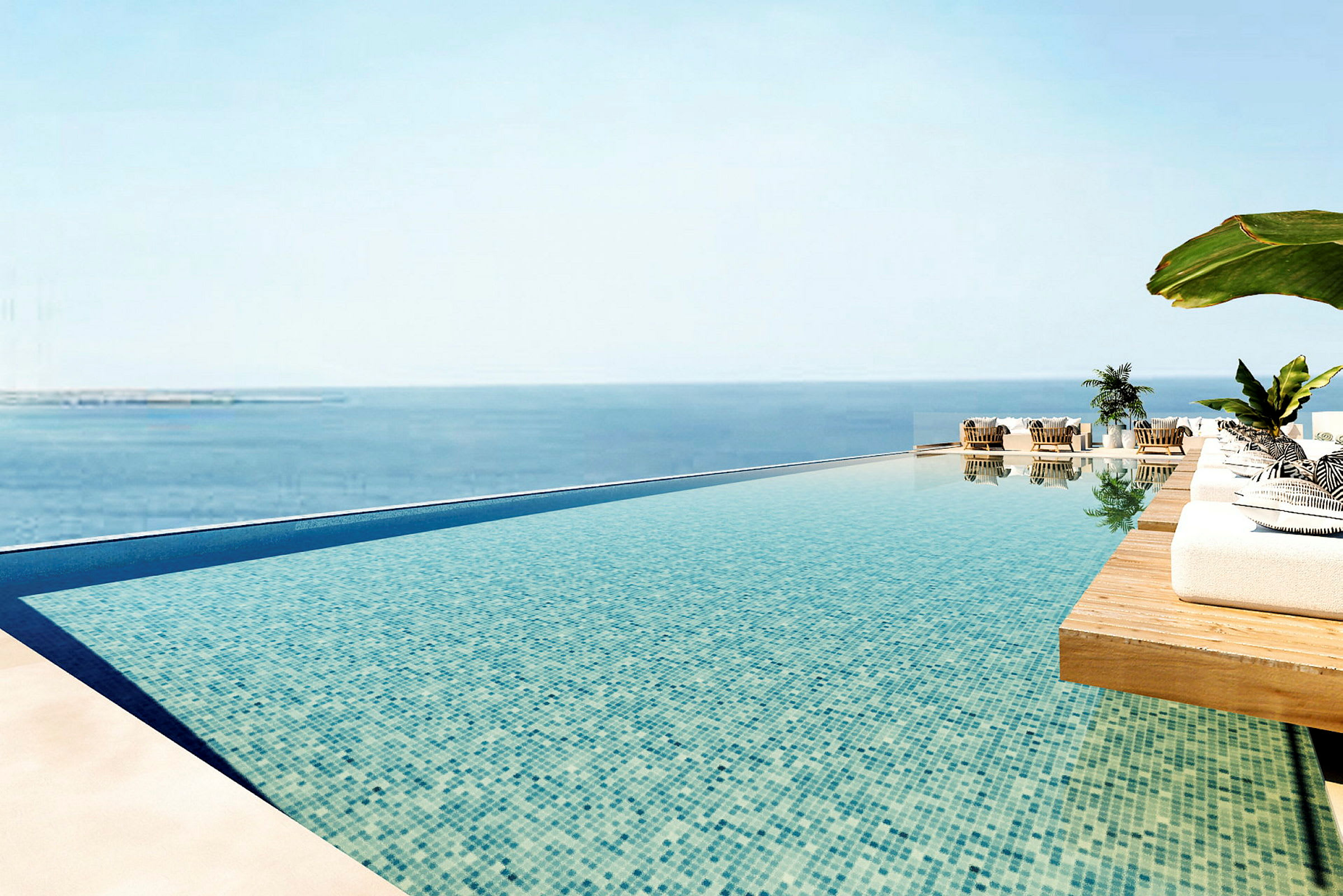 En infinitypool med utsikt över havet och solstolar omkring. (AI-genererad text)