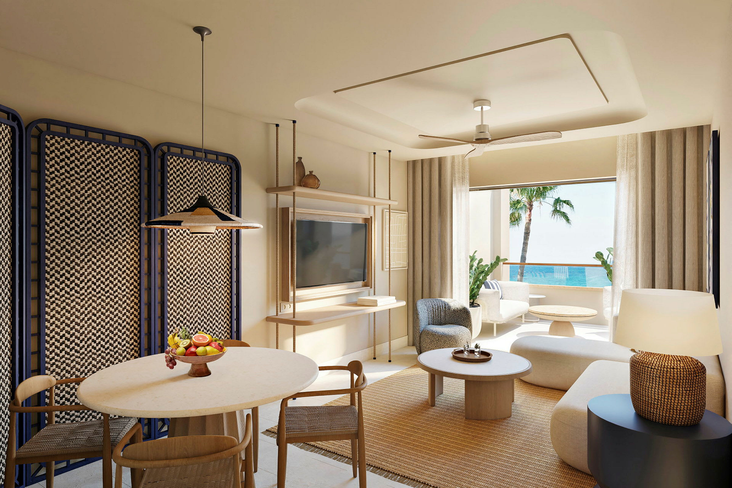 En modern inredd hotellsvit med sittgrupp, matbord och havsutsikt. (AI-genererad text)