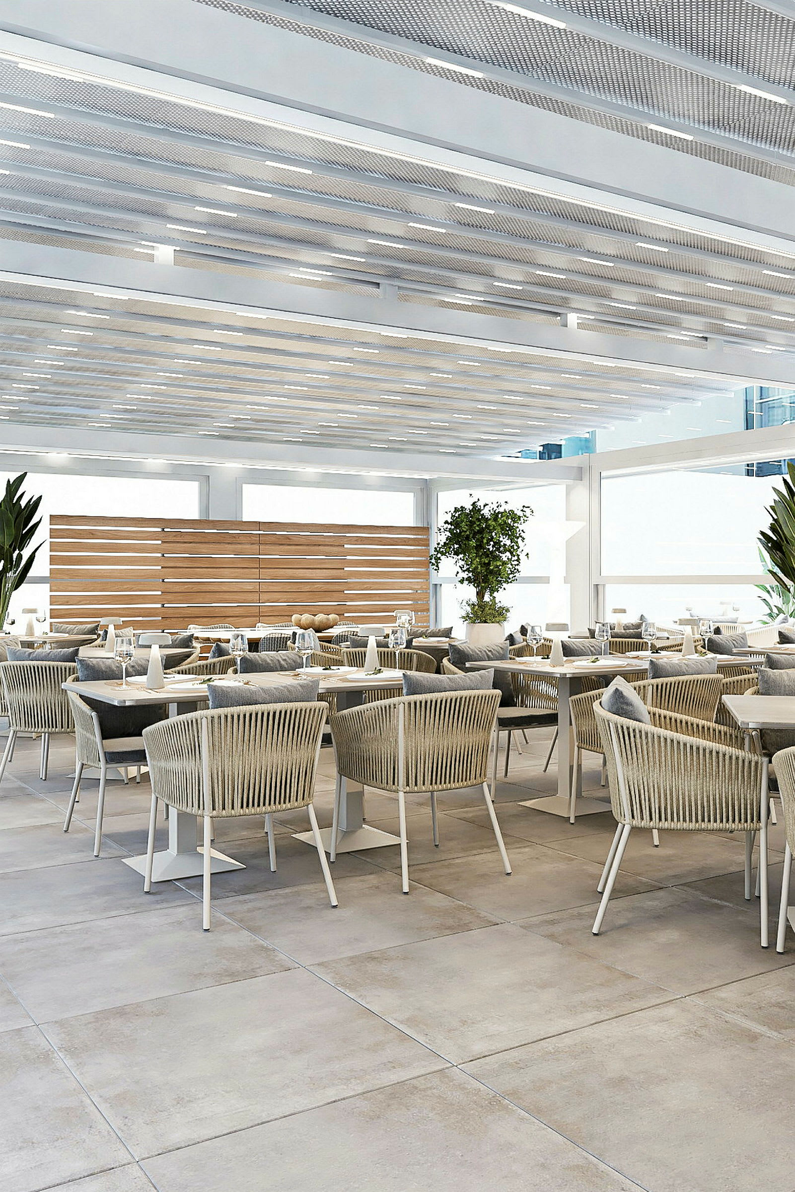En modern restaurang med bekväma stolar och bord placerade i en ljus och luftig inredning. (AI-genererad text)