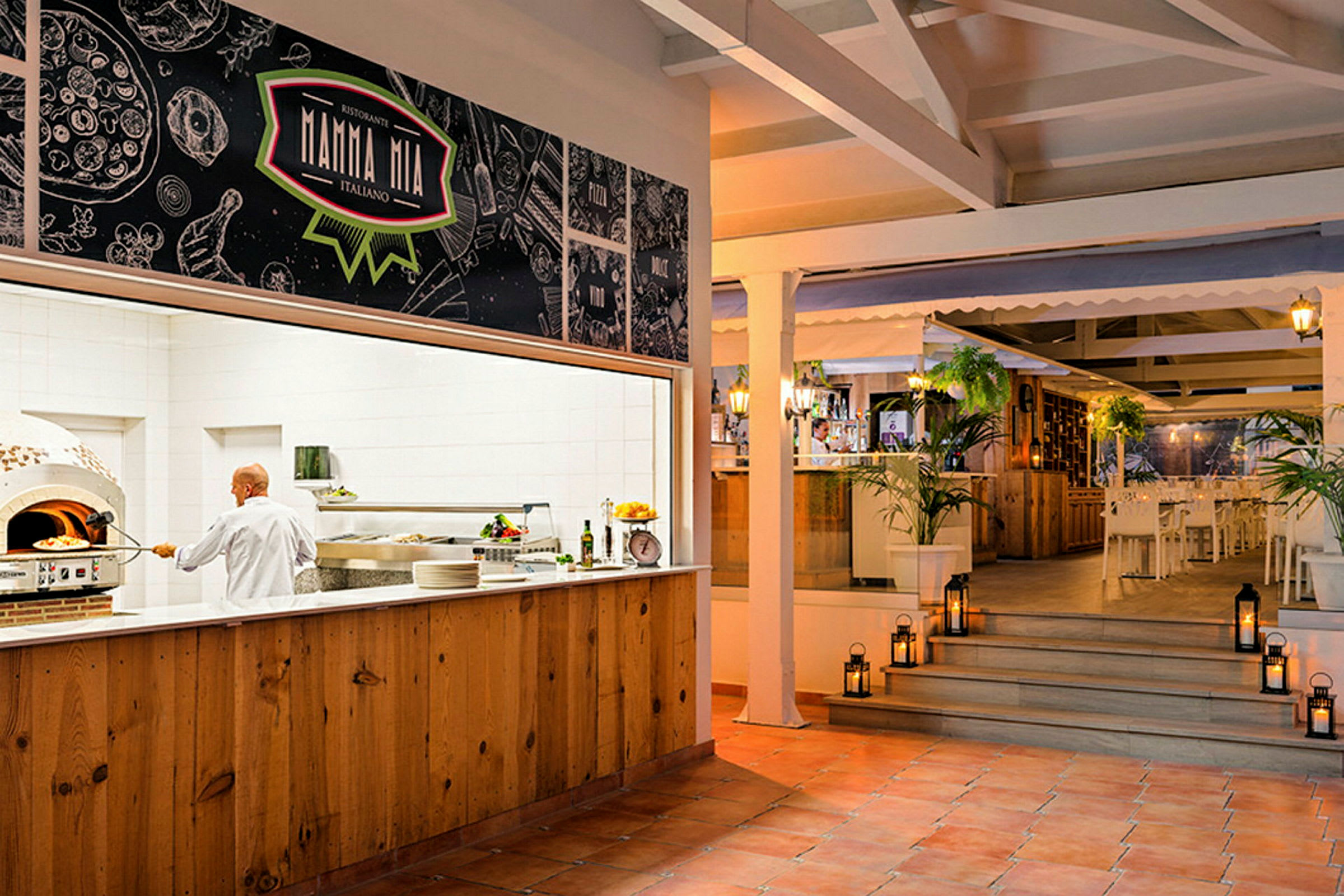 Interiör av en restaurang med italienskt tema, inklusive en serveringsdisk och sittplatser. (AI-genererad text)