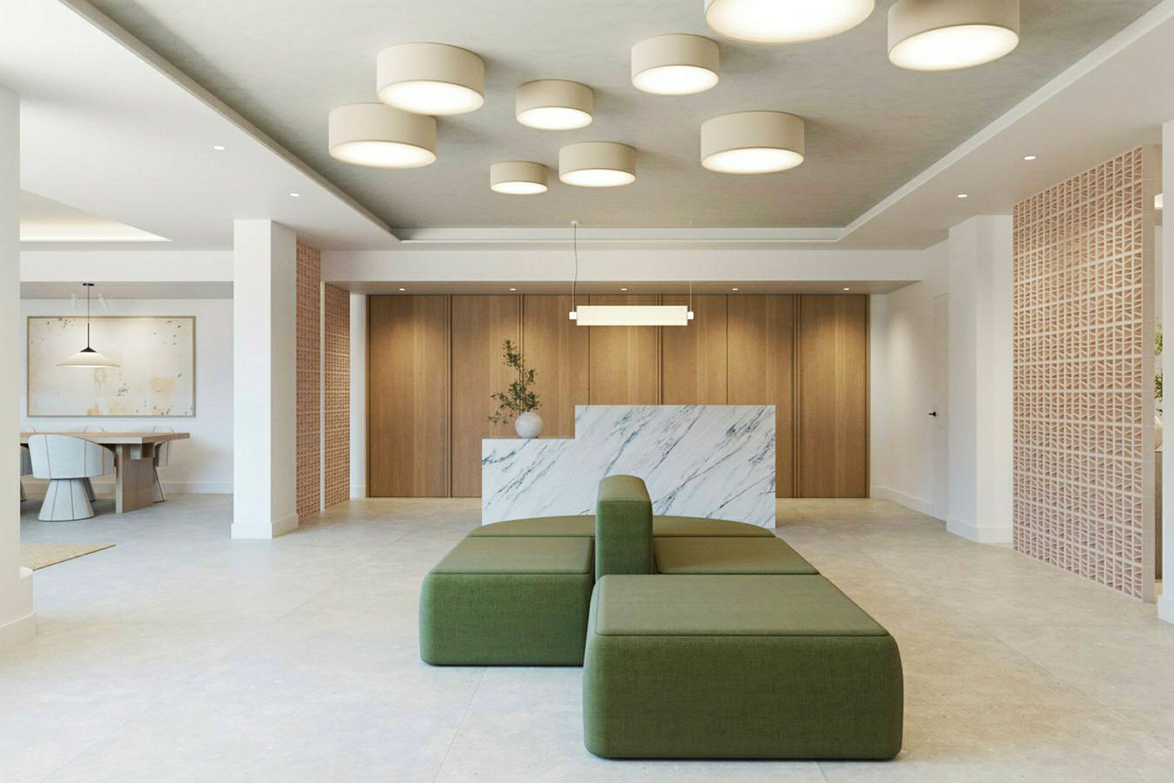 Modern lobby med gröna sittmöbler och marmorinredning. (AI-genererad text)