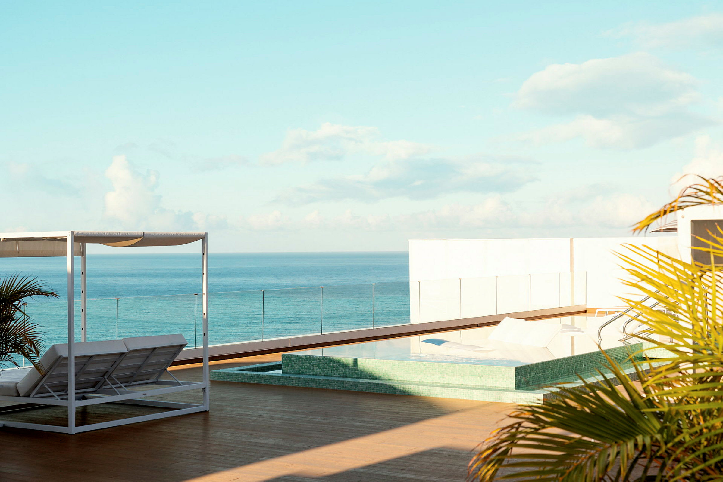 Terrass med pool och solsängar med utsikt över havet. (AI-genererad text)