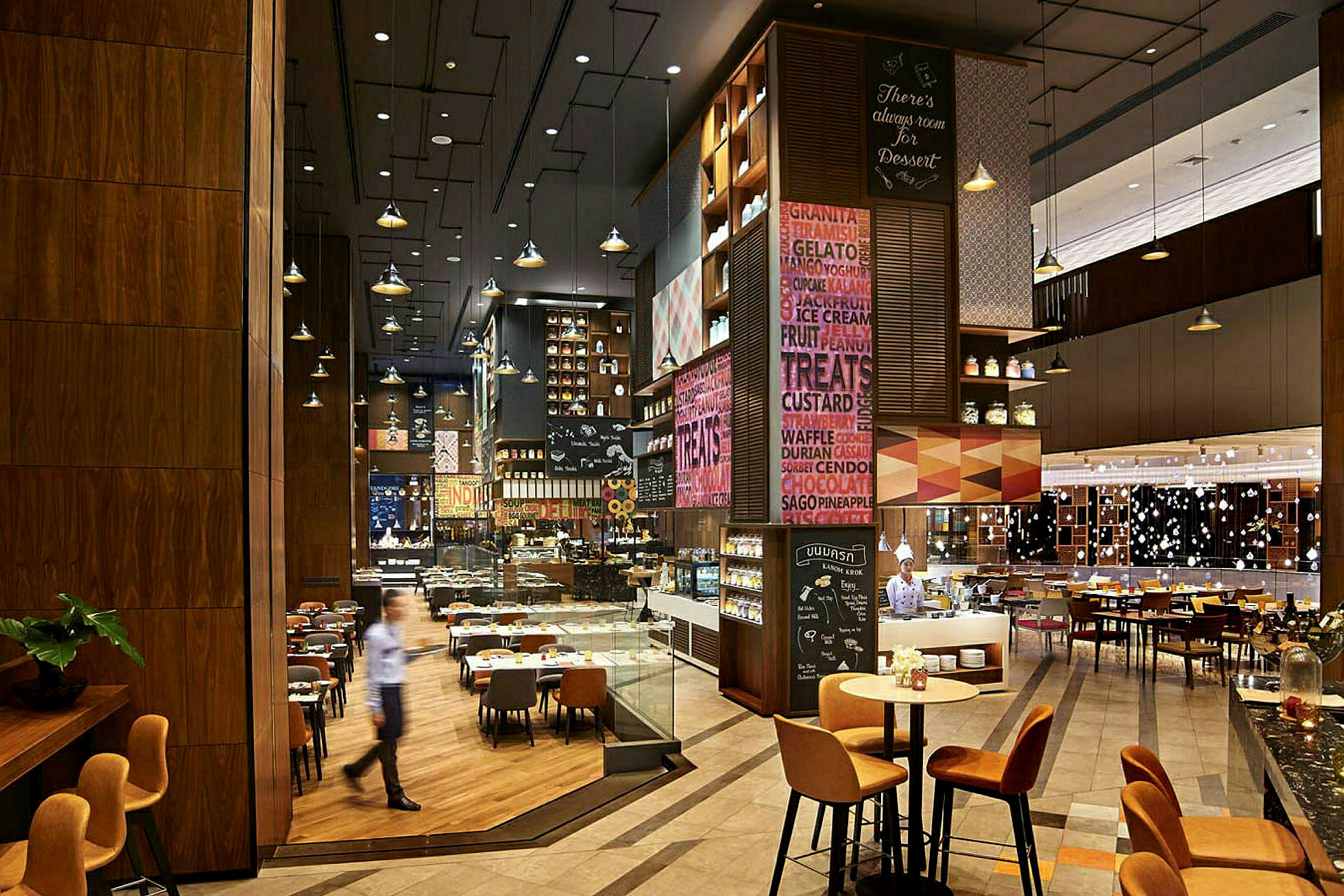 Bild av en modern restauranginteriör med olika sittplatser, dekorationer och belysningsdetaljer. (AI-genererad text)
